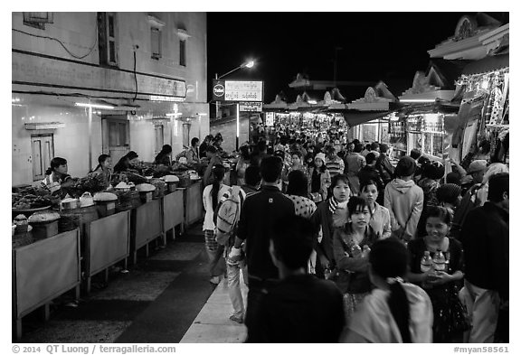 Food vendors and souvenir shops at night, Potemkin village. Kyaiktiyo, Myanmar (black and white)