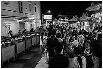 Food vendors and souvenir shops at night, Potemkin village. Kyaiktiyo, Myanmar ( black and white)