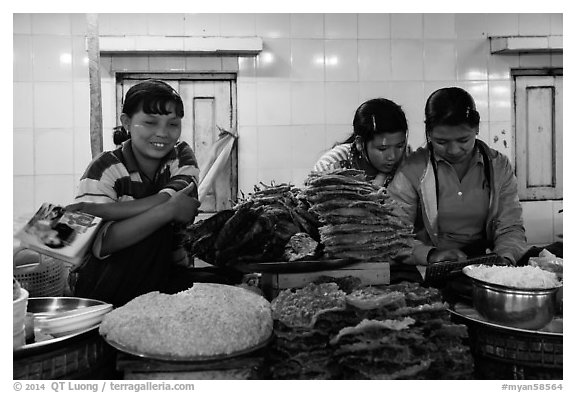 Food vendors reading, Potemkin village. Kyaiktiyo, Myanmar (black and white)