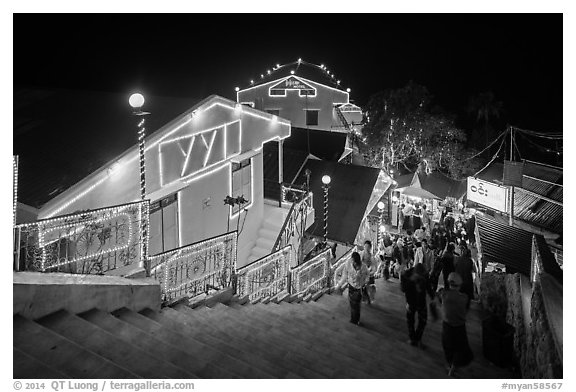 Colorfully lit guesthouses for Burmese people. Kyaiktiyo, Myanmar (black and white)