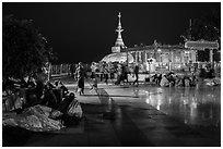 Pilgrims wake up after sleeping on plaza behind Golden Rock. Kyaiktiyo, Myanmar ( black and white)