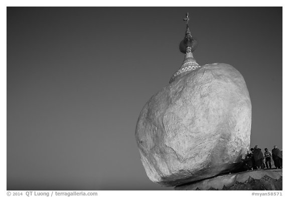 Golden Rock balancing boulder stupa and monks at dawn. Kyaiktiyo, Myanmar (black and white)