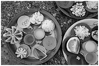 Close-up of food offerings. Kyaiktiyo, Myanmar ( black and white)