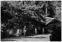 Monk walking barefoot on the path to the Golden Rock. Kyaiktiyo, Myanmar ( black and white)