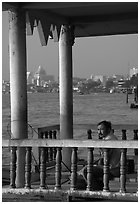 Man fishing on the Chao Phraya river. Bangkok, Thailand (black and white)