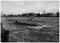 Crowded long tail taxi boat on Chao Phraya river. Bangkok, Thailand (black and white)