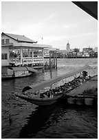 Evening commute, long tail taxi boat on Chao Phraya river. Bangkok, Thailand (black and white)