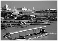 Flotilla of boats on the Chao Phraya river. Bangkok, Thailand (black and white)