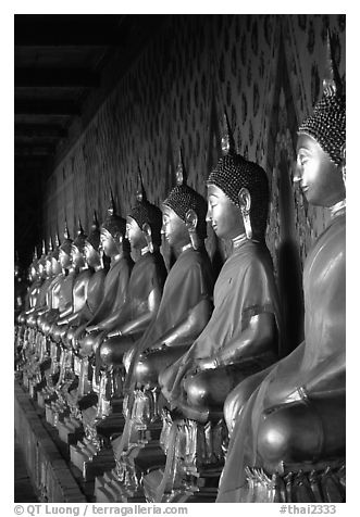 Row of Buddha statues in gallery, Wat Arun. Bangkok, Thailand