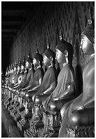 Row of Buddha statues in gallery, Wat Arun. Bangkok, Thailand (black and white)