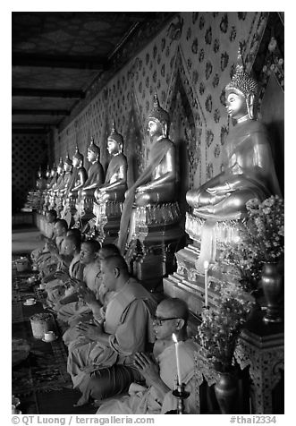 Buddhist monks and buddha statues, Wat Arun. Bangkok, Thailand (black and white)