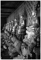 Buddhist monks and buddha statues, Wat Arun. Bangkok, Thailand ( black and white)