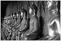 Row of Buddha figures, Wat Arun. Bangkok, Thailand (black and white)