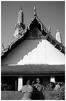 Monks outside Wat Arun. Bangkok, Thailand (black and white)