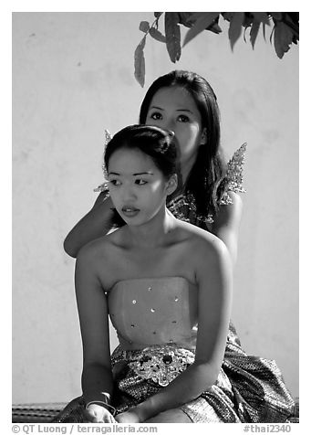 Mother helps daughter with traditional thai attire, Wat Arun. Bangkok, Thailand (black and white)