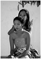 Mother helps daughter with traditional thai attire, Wat Arun. Bangkok, Thailand ( black and white)