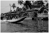 Fast boat along khlong on Thonbury canals. Bangkok, Thailand (black and white)