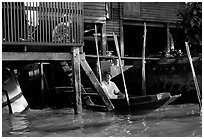 Conversation with neighbor along Thonbury canal. Bangkok, Thailand ( black and white)