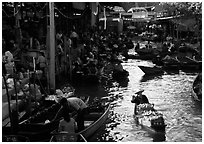 Woman paddling, floating market. Damonoen Saduak, Thailand (black and white)