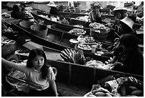 Woman on small boat, floating market. Damonoen Saduak, Thailand (black and white)