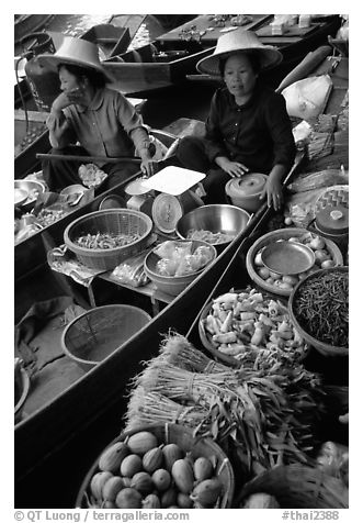 Women selling fruits and vegetables, Floating market. Damonoen Saduak, Thailand