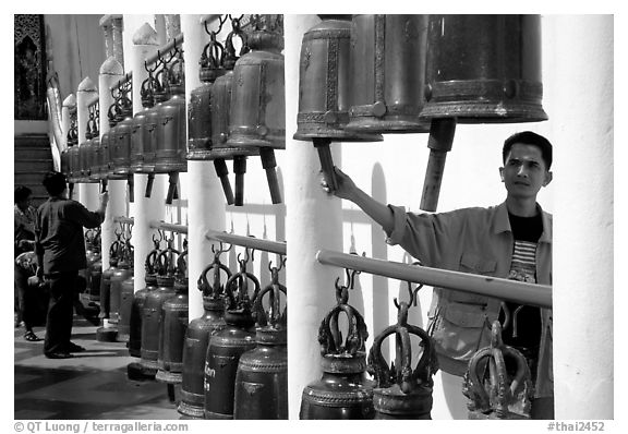 Worshiper rings bells at Wat Phra That Doi Suthep. Chiang Mai, Thailand