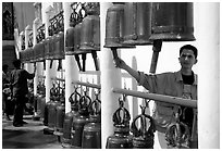 Worshiper rings bells at Wat Phra That Doi Suthep. Chiang Mai, Thailand ( black and white)