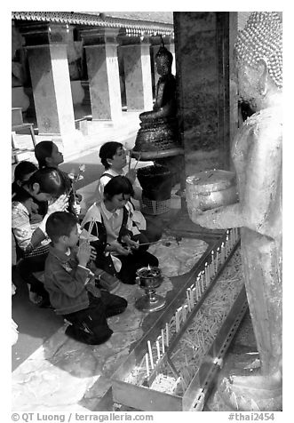 Worshipers at Wat Phra That Doi Suthep, the North most sacred temple. Chiang Mai, Thailand (black and white)