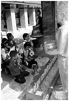 Worshipers at Wat Phra That Doi Suthep, the North most sacred temple. Chiang Mai, Thailand (black and white)