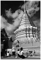 Worshipers at the Chedi of Wat Phra That Doi Suthep. Chiang Mai, Thailand (black and white)