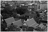 Temple roofs and modern buildings from above. Bangkok, Thailand (black and white)