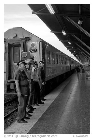 Attendants and train, Hualamphong station. Bangkok, Thailand (black and white)