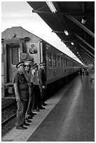 Attendants and train, Hualamphong station. Bangkok, Thailand (black and white)