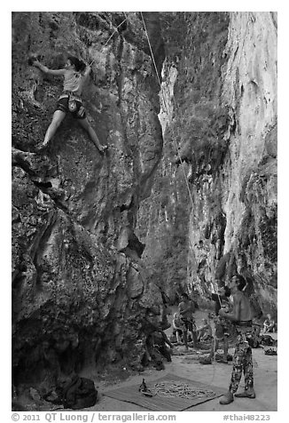 Rock climbers on beach, Ao Railay East. Krabi Province, Thailand (black and white)