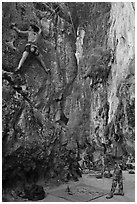 Rock climbers on beach, Ao Railay East. Krabi Province, Thailand (black and white)