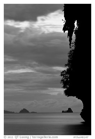 Seascape with limestone islets, stalactite, dusk, Andamam Sea. Krabi Province, Thailand