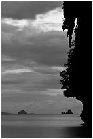 Seascape with limestone islets, stalactite, dusk, Andamam Sea. Krabi Province, Thailand (black and white)