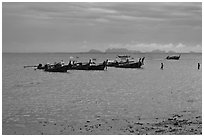 Boats anchored at low tide, storm sky,  Railay East. Krabi Province, Thailand (black and white)