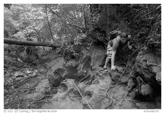 Hiker on steep trail, Laem Phra Nang, Rai Leh. Krabi Province, Thailand