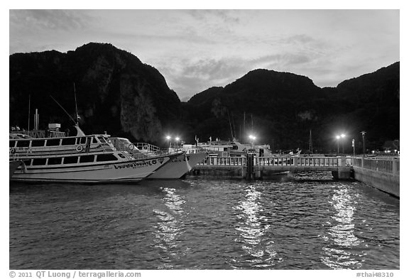 Harbor and cliffs at dusk, Ko Phi-Phi island. Krabi Province, Thailand (black and white)