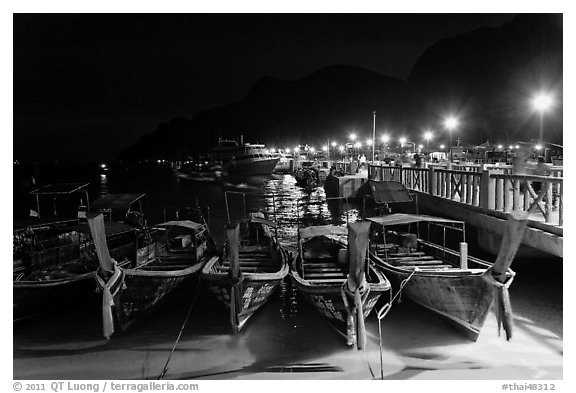 Long tail boats and pier at night, Ko Phi Phi. Krabi Province, Thailand (black and white)