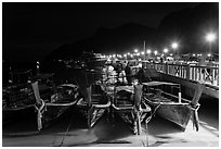 Long tail boats and pier at night, Ko Phi Phi. Krabi Province, Thailand ( black and white)