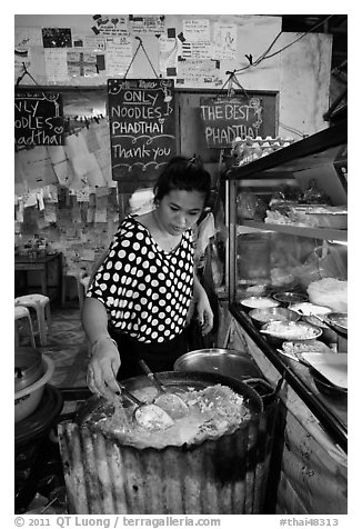 Woman preparing Pad Thai, Phi-Phi island. Krabi Province, Thailand (black and white)