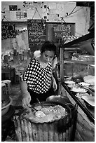 Woman preparing Pad Thai, Phi-Phi island. Krabi Province, Thailand (black and white)