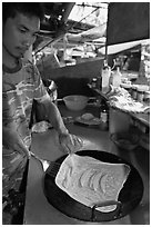Man preparing thai pancake, Tonsai village, Ko Phi Phi. Krabi Province, Thailand (black and white)
