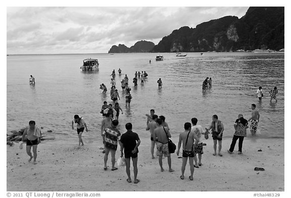 Beach with tourists arriving, Phi-Phi island. Krabi Province, Thailand (black and white)