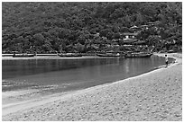 Man standing alone on beach, Ao Lo Dalam, Phi-Phi island. Krabi Province, Thailand ( black and white)