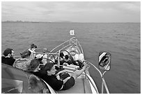 Passengers on prow of boat. Krabi Province, Thailand ( black and white)