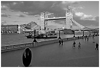 Waterfront promenade in the more London development and Tower Bridge, late afternoon. London, England, United Kingdom ( black and white)