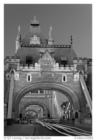 Traffic light trails on Tower Bridge, dusk. London, England, United Kingdom (black and white)